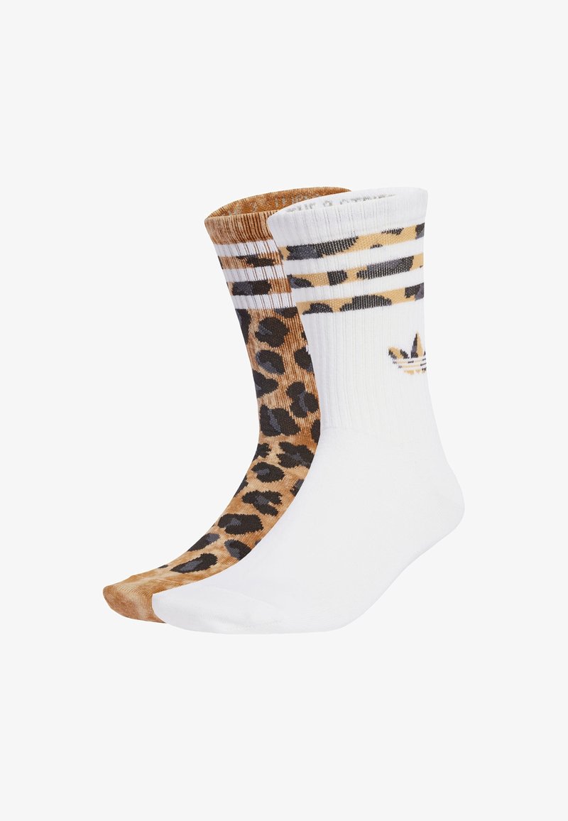 Dva páry ponožiek: jedny s leopardím vzorom v hnedej a čiernej farbe; jedny úplne biele s tromi horizontálnymi pruhmi na vrchu. Materiál z bavlnenej zmesi.