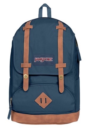 Zaino blu navy con dettagli in pelle, dotato di chiusura a pattina, tasca frontale e spallacci regolabili. Accessori in metallo dorato visibili.