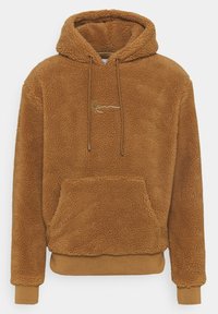 Brown fleece hooded sweatshirt with a textured outer layer, front pocket, and gold embroidered logo. Ribbed cuffs and hem.