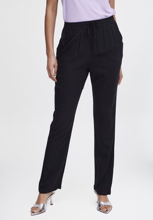 Pantalons de jogging légers et noirs avec une taille élastique et un cordon de serrage, dotés de poches latérales et d'un design à jambe droite.