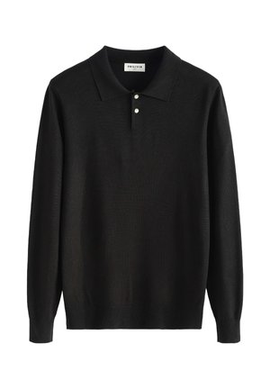 Polo à manches longues noir avec deux boutons blancs et un ourlet et des poignets côtelés, posé à plat sur un fond blanc.