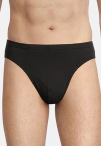 Boxer in cotone nero con una texture liscia, vita elasticizzata e senza motivi. Progettati per il comfort con una forma aderente e cuciture sottili.