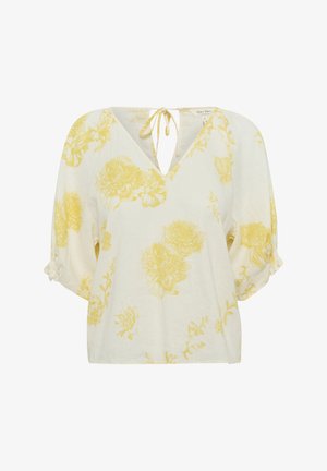 Blusa bianca con motivo floreale giallo, caratterizzata da un collo a V e dettaglio con fiocco. Maniche corte a sbuffo con accenti arricciati.