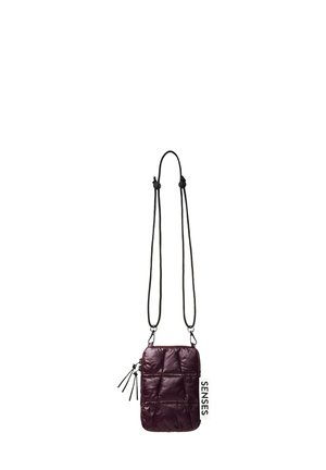 Burgundy crossbody bag with quilted texture, adjustable drawstring straps, side zipper, and "SENSES" label detail. Compact and rectangular shape.