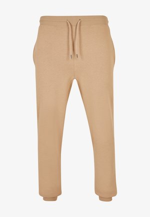 Beige bomulls joggere med elastisk midjebånd, justerbar snøring, sidelommer og innsvingte mansjetter ved anklene.