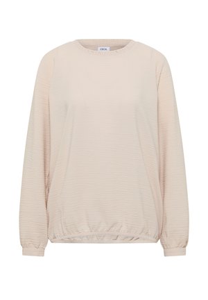 Top manica lunga beige chiaro con tessuto strutturato e leggermente stropicciato. Presenta una scollatura rotonda e polsini ed orlo elasticizzati. Etichetta del marchio visibile.
