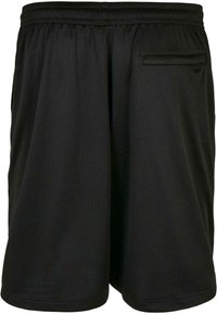 Shorts de sport noirs en tissu en maille léger, dotés d'une taille élastique et d'une poche arrière avec un motif de couture subtil.