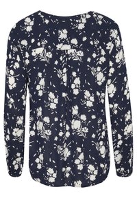 Blouse à manches longues bleu marine avec un motif floral blanc, dos plissé, encolure ronde et tissu doux et léger.