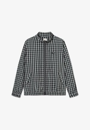 Črno-siva karo jopiči z zadrgo, stoječim ovratnikom, dvema sprednjima žepoma, elastičnim spodnjim robom in majhno črno logotipsko značko na prsih.