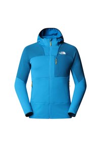 Giacca blu realizzata in tessuto testurizzato con chiusura a zip, cappuccio regolabile e pannelli blu scuri a contrasto. Presenta tasche con zip e logo.