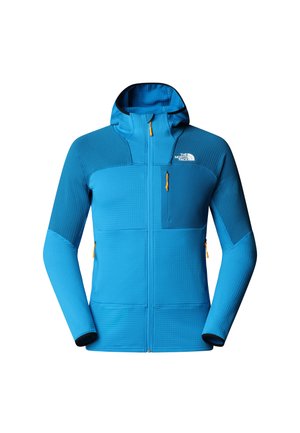 Blauwe jas van luxe stof met een rits aan de voorkant, verstelbare capuchon en contrasterende donkerblauwe panelen. Voorzien van ritssluitingen en een logo.