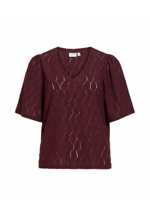 Blouse bordeaux à manches courtes avec manches bouffantes, encolure en V et motif géométrique en dentelle sur tout le tissu.