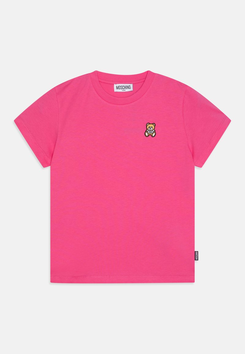 Rózsaszín pamut póló rövid ujjakkal. Bal mellen egy kis mackó logó hímezve. Kerek kivágás, laza fazon.