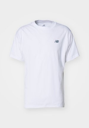 White cotton t-shirt featuring a crew neckline, short sleeves, and a subtle gray New Balance logo on the left chest.