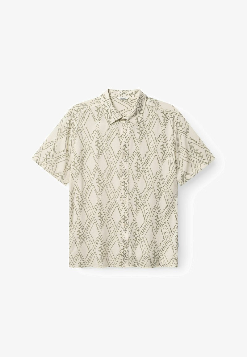 Rövid ujjú ing világos bézs színben, zöld geometriai gyémántmintával és galléros nyakkivágással. Könnyű, sima anyagból készült.