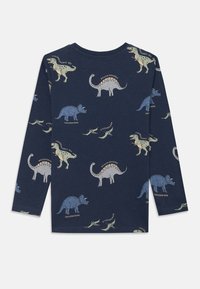 Navy long-sleeve T-shirt with a dinosaur print, featuring various dino illustrations in light colors and names beneath each design.