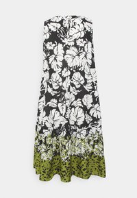 Maxiklänning med svart botten och vita blommönster samt en grön nederdel med prickigt tryck. Ärmlös design, knäppning bak.