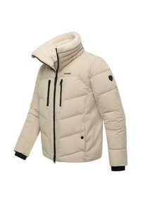 Bež pamukasta jakna s krznom obloženim ovratnikom, crnim patentnim zatvaračima i dva prednja džepa. Ima elastične manžete i logo na rukavu.