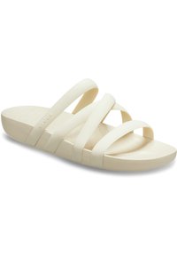 Sandali slide beige chiaro con tre ampie cinghie, realizzati in materiale flessibile. La soletta presenta una superficie testurizzata per la presa.