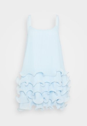 Light blue sleeveless dress with ribbed texture, featuring layered ruffles at the hem. Smooth fabric with a simple square neckline.