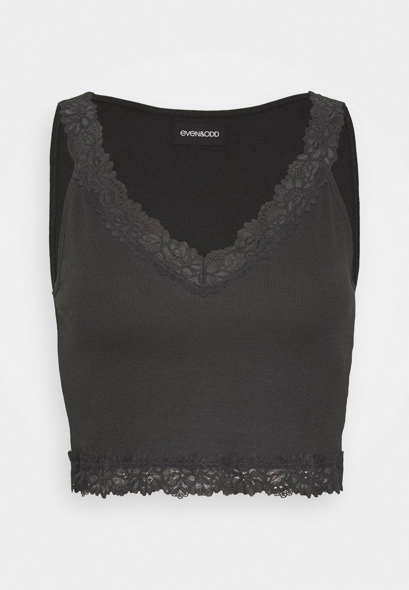 Black cropped tank top made from ribbed fabric. Features a lace trim along the neckline and bottom hem, with a fitted design.