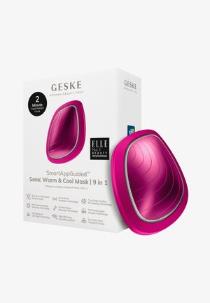 Pink sonic facial mask with curved design and textured surface. Box features logo and technology highlights, emphasizing its 9-in-1 functionality.