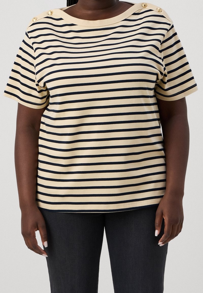 Striped short-sleeve top in beige and navy blue, featuring decorative buttons on the shoulder, made of soft material with a relaxed fit.