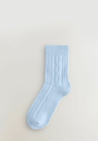 Light blue cotton sock with ribbed cuff, featuring cable-knit detailing along the side and a smooth texture.