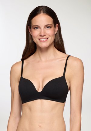 Reggiseno nero con ferretto, spalline regolabili, scollatura profonda, texture liscia e design senza cuciture. Adatto per l'uso quotidiano.