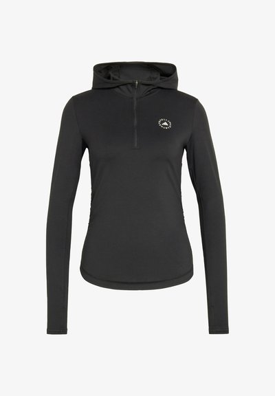 Black long-sleeve pullover with hood, featuring a half-zip front and a circular logo on the chest. Smooth, lightweight fabric with a fitted design.