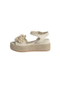 Beige platform sandalen met stoffen bloemenaccenten, leren banden en jute-omhulde zolen. Verstelbare enkelband met metalen gesp.