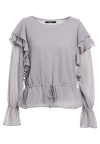 Blusa grigia chiara con maniche a volant, vita elastica e dettaglio con fiocco. Realizzata in materiale trasparente con texture liscia. Polsini a campana.