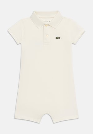 Cream-colored short-sleeve baby romper with collar, two buttons, and a small green crocodile logo on the left chest.
