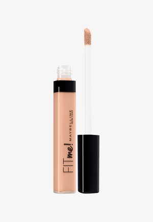 Correcteur liquide Maybelline FIT Me dans un tube transparent avec un capuchon noir. Couleur beige clair, avec un applicateur en mousse doux et moelleux.