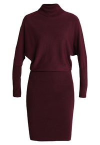 Abito a maniche lunghe in maglia bordeaux con scollatura alta e gonna aderente, caratterizzato da una parte superiore ampia e blouson.