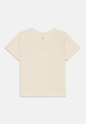 Krämfärgad t-shirt med kort ärm i ribbat tyg, rund halsringning och subtilt broderad "GAP"-logga i ljusblått.