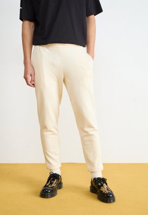 ELEVATED - Tracksuit bottoms - offwhite