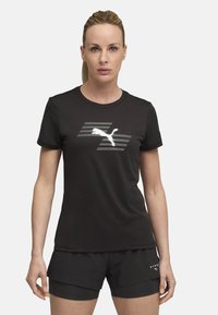 Black athletic t-shirt with short sleeves, featuring a reflective white logo on the chest and smooth, lightweight fabric.