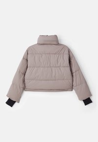 Puffer jacket in light taupe, features a high collar, quilted design, and black knit cuffs; cropped silhouette, smooth texture.
