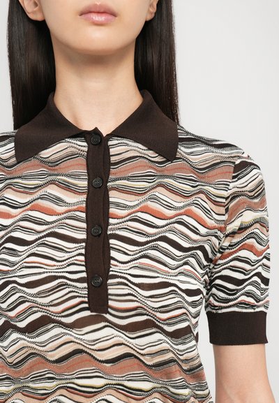 Polo shirt with a brown collar, featuring a wave pattern in beige, rust, brown, and black. Five black buttons down the front.