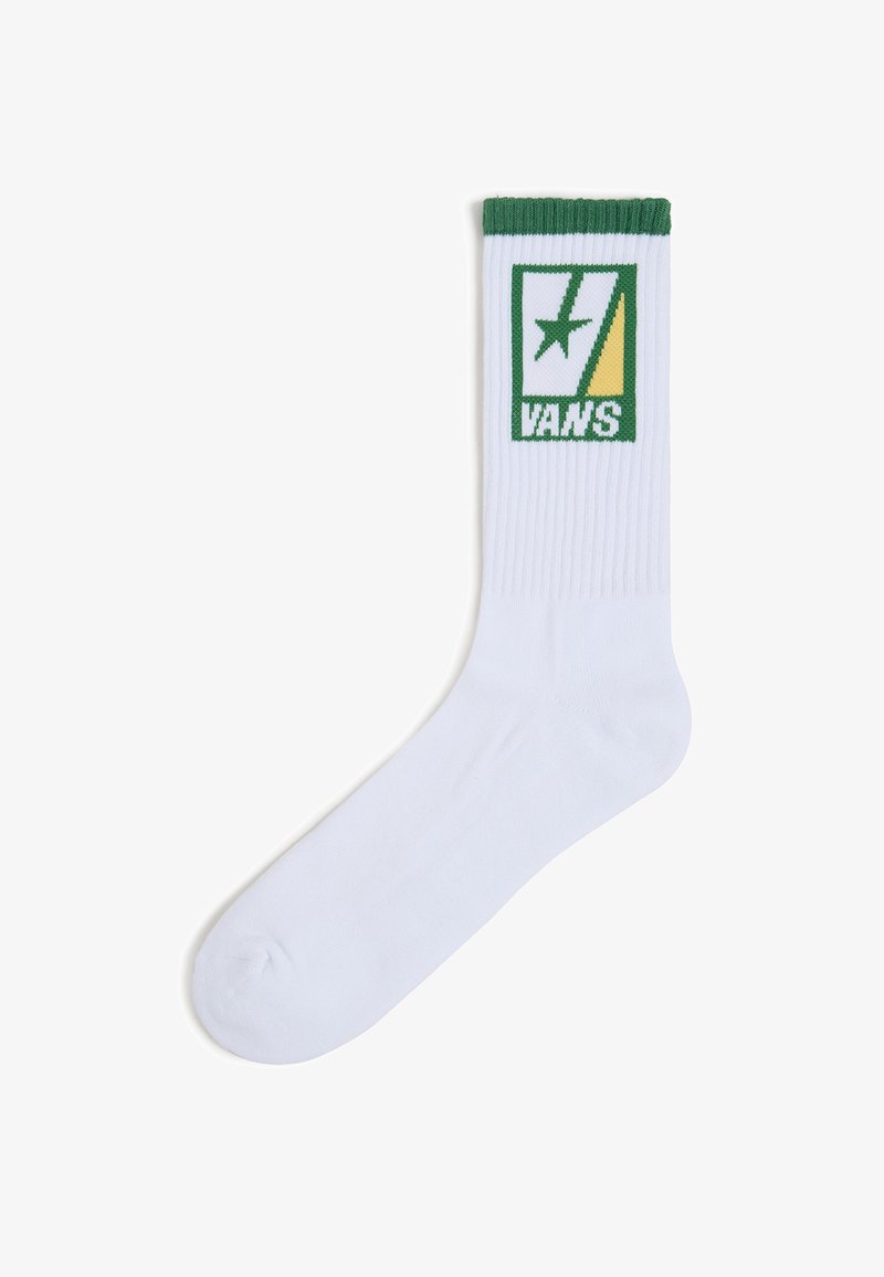 Bílá bavlněná ponožka do kotníku s ribovaným lemem, se zeleno-žlutým designem loga Vans na přední straně. Měkká textura, jednotný tvar.
