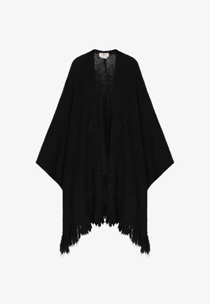 Melnā adīta pončo ar plašām piedurknēm, kam ir frizēta apakša un smalki ziedu raksti auduma tekstūrā. Atvērta priekšpuses dizains.