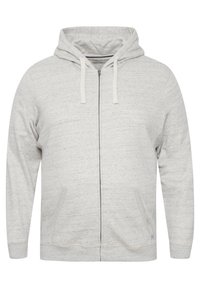 Lys grå zip-up hettegenser med snor i hetten og lommer foran, vist på en hvit bakgrunn.