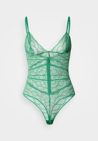 Roheline pitsist bodi reguleeritavate rihmadega, millel on geomeetrilised mustrid ja läbipaistev tekstuur. Thongi lõikega alumine osa peente detailidega.