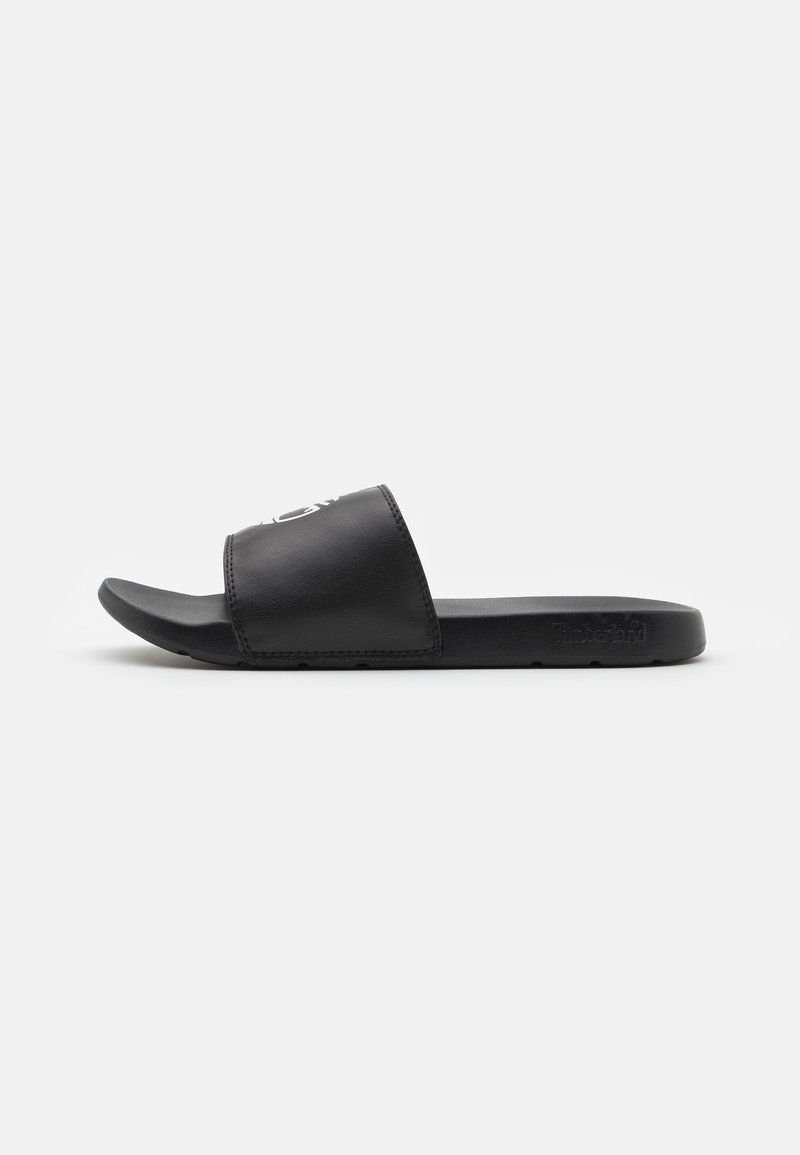 Svart slip in-sandal i glatt syntetläder, med en bred rem och en formad sula med subtil logodetalj.