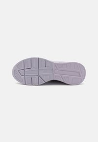 Purple rubber shoe sole with a textured design. Features grooves and patterns for traction, with a smooth edge outline.