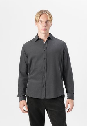 Dark gray button-up shirt with long sleeves, a collar, and a smooth fabric texture. Features a straight hem and standard cuffs.