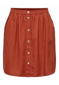 Gonna color ruggine con vita arricciata, chiusura frontale con cinque bottoni e tasche laterali. Realizzata in un tessuto leggero e testurizzato.