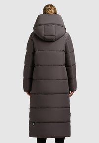 Long, puffy coat in dark gray, featuring a large hood, horizontal quilted pattern, and side pockets, reaching mid-calf length.