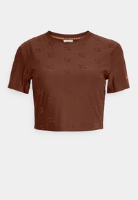 Brun croppad t-shirt i slätt tyg med ett präglat mönster av Nike-logotypen och texten "AIR". Korta ärmar och rund halsringning.